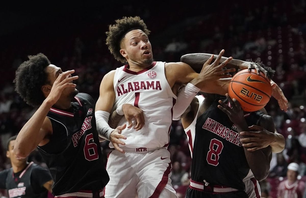 Dec 4, 2023; Tuscaloosa, Alabama, USA;  Arkansas State guard Taryn Todd (6), Alabama guard Mark Sears (1) and Arkansas State forward Lado Laku (8) fight to control a rebound at Coleman Coliseum.