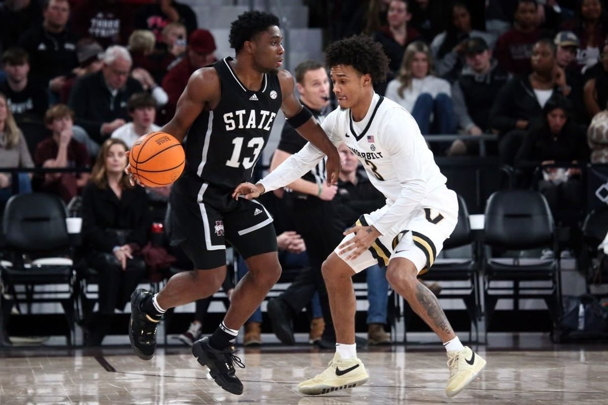 Jan 20, 2024; Starkville, Mississippi, USA; Mississippi State Bulldogs guard Josh Hubbard (13) dribbles as Vanderbilt Commodores guard Paul Lewis (3) defends during the second half at Humphrey Coliseum.