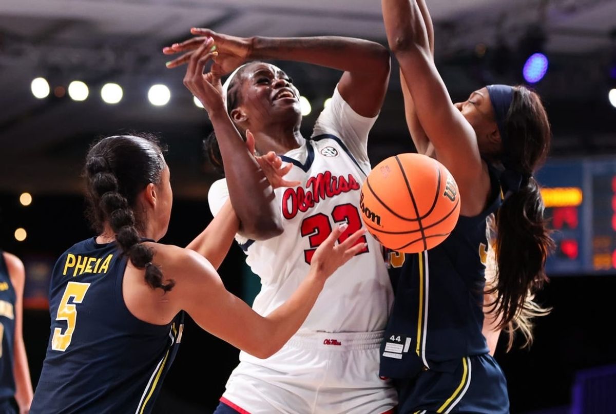 Ole Miss Rebels center Rita Igbokwe (32) goes up against Michigan Wolverines guard Laila Phelia (5) during the first half at Imperial Arena.