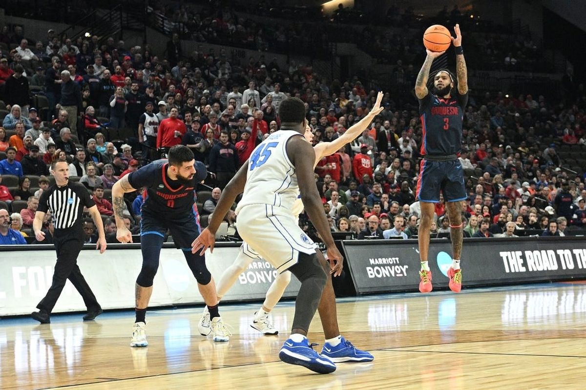 Mar 21, 2024; Omaha, NE, USA;  Duquesne Dukes guard Dae Dae Grant (3) shoots during the first half against the Brigham Young Cougars during the first round of the NCAA Tournament at CHI Health Center Omaha.