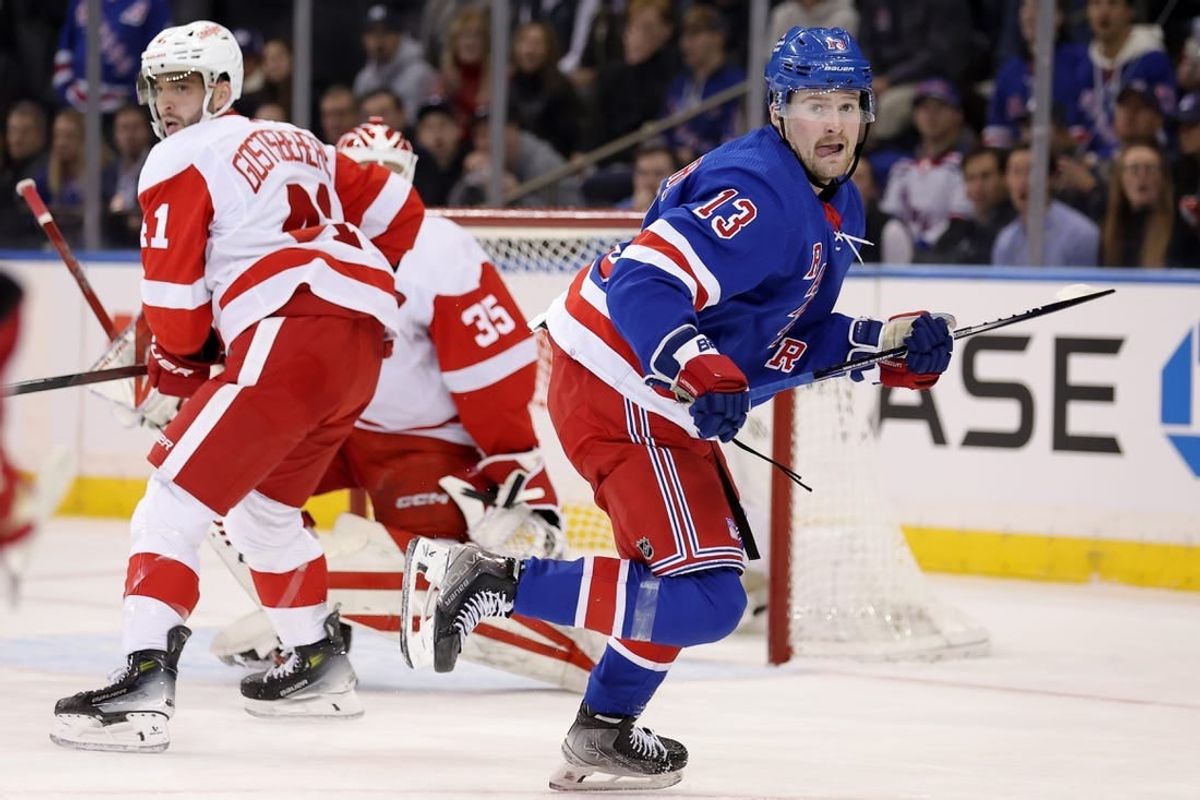 Nov 29, 2023; New York, New York, USA; New York Rangers left wing Alexis Lafreniere (13) skates against Detroit Red Wings defenseman Shayne Gostisbehere (41) and goaltender Ville Husso (35) during the first period at Madison Square Garden.