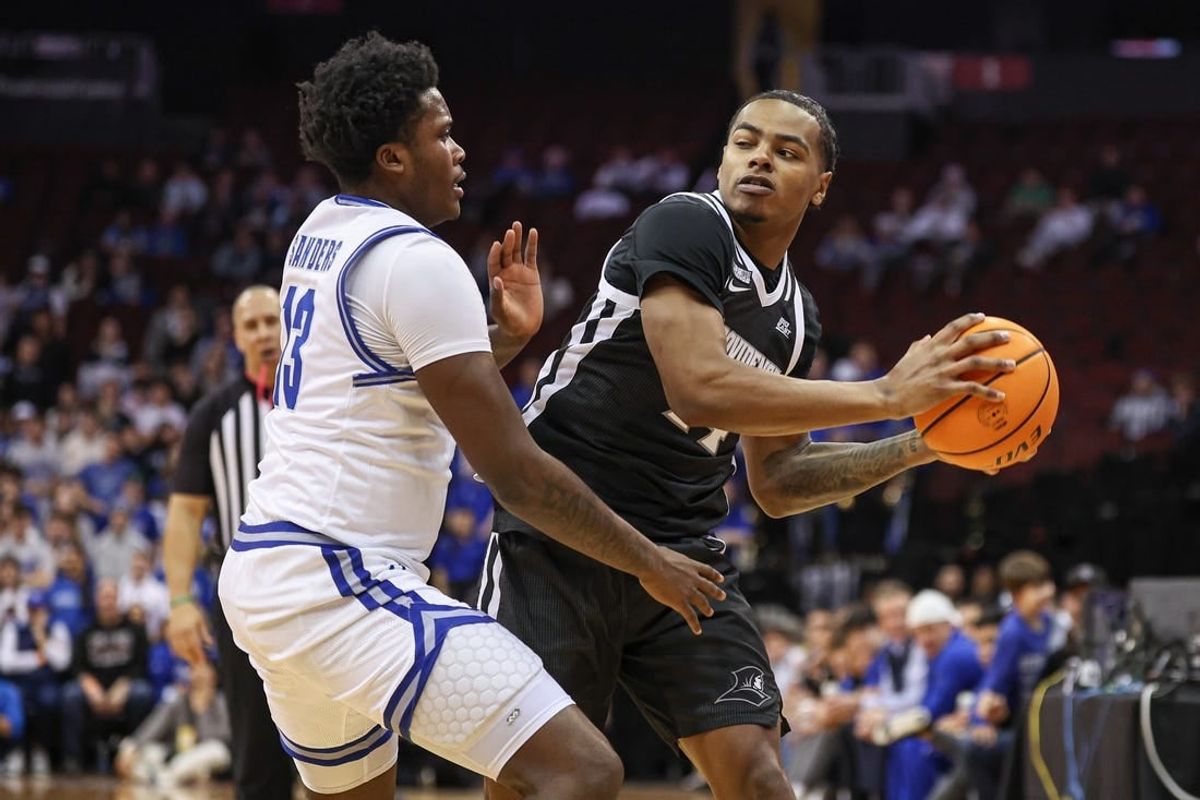 Jan 24, 2024; Newark, New Jersey, USA;  Providence Friars guard Luke Fonts (24) looks to pass as Seton Hall Pirates guard Jaquan Sanders (13) defends during the first half at Prudential Center.