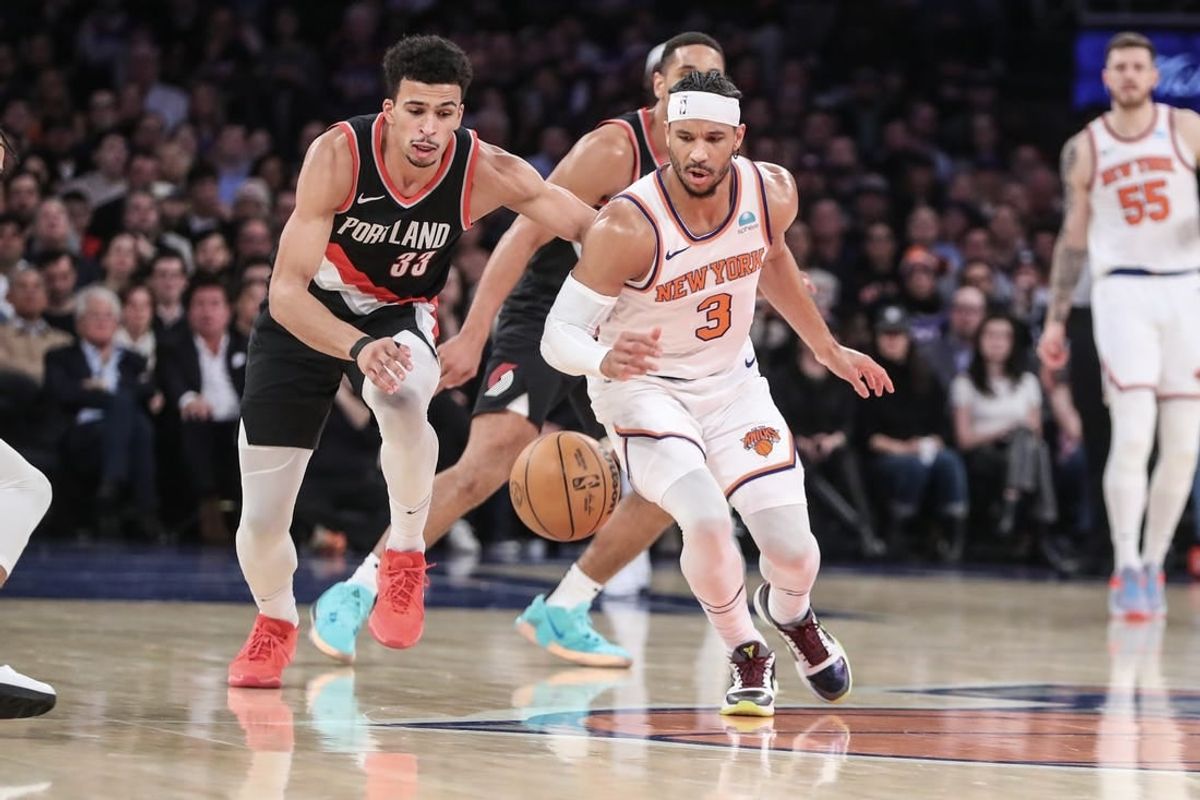 Jan 9, 2024; New York, New York, USA; Portland Trail Blazers forward Toumani Camara (33) and New York Knicks guard Josh Hart (3) chase a loose ball in the second quarter at Madison Square Garden.