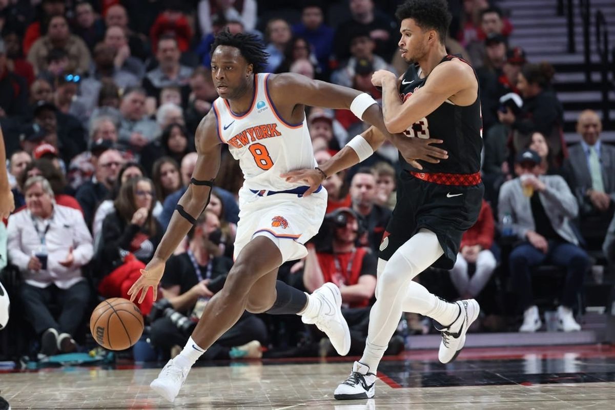 Mar 14, 2024; Portland, Oregon, USA;  New York Knicks forward OG Anunoby (8) controls the ball against Portland Trail Blazers forward Toumani Camara (33) in the fourth quarter at Moda Center.