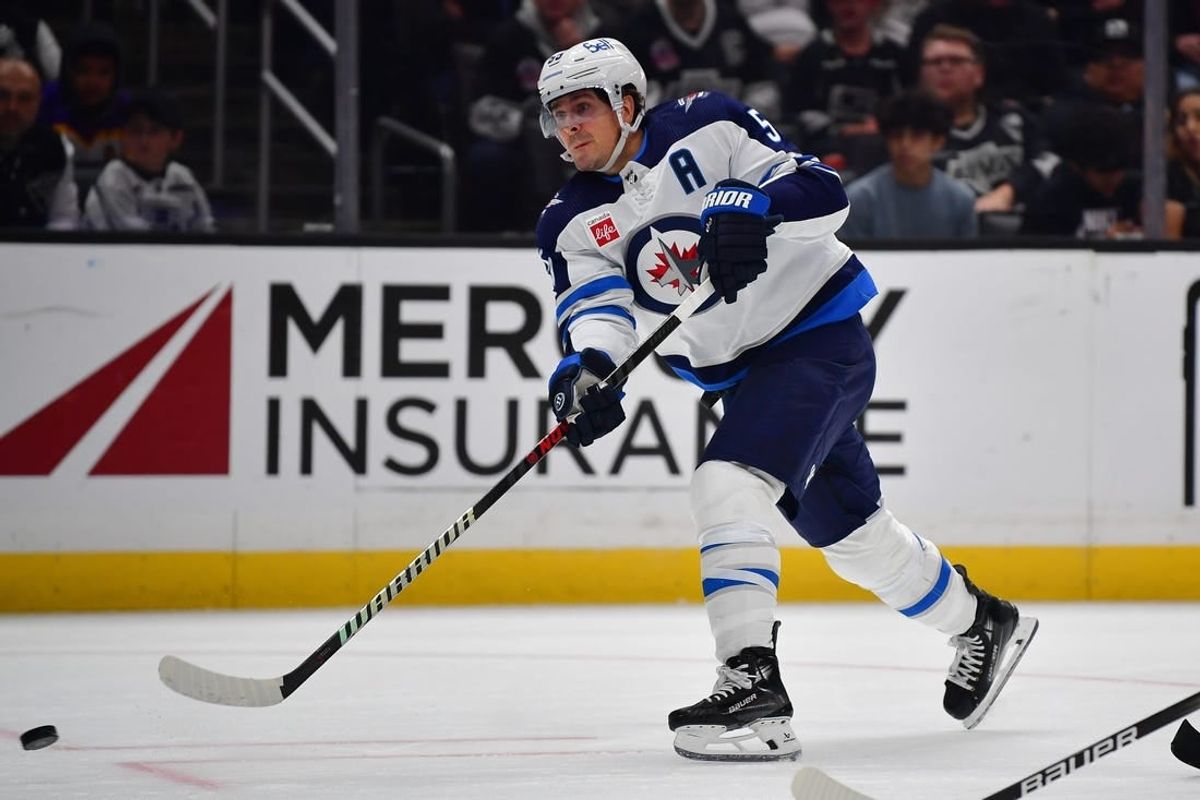 Dec 13, 2023; Los Angeles, California, USA; Winnipeg Jets center Mark Scheifele (55) shoots on goal against the Los Angeles Kings during the third period at Crypto.com Arena.