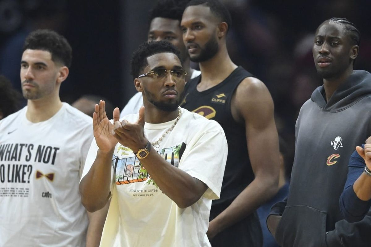 Mar 3, 2024; Cleveland, Ohio, USA; Cleveland Cavaliers guard Donovan Mitchell (front) reacts in the second quarter against the New York Knicks at Rocket Mortgage FieldHouse.