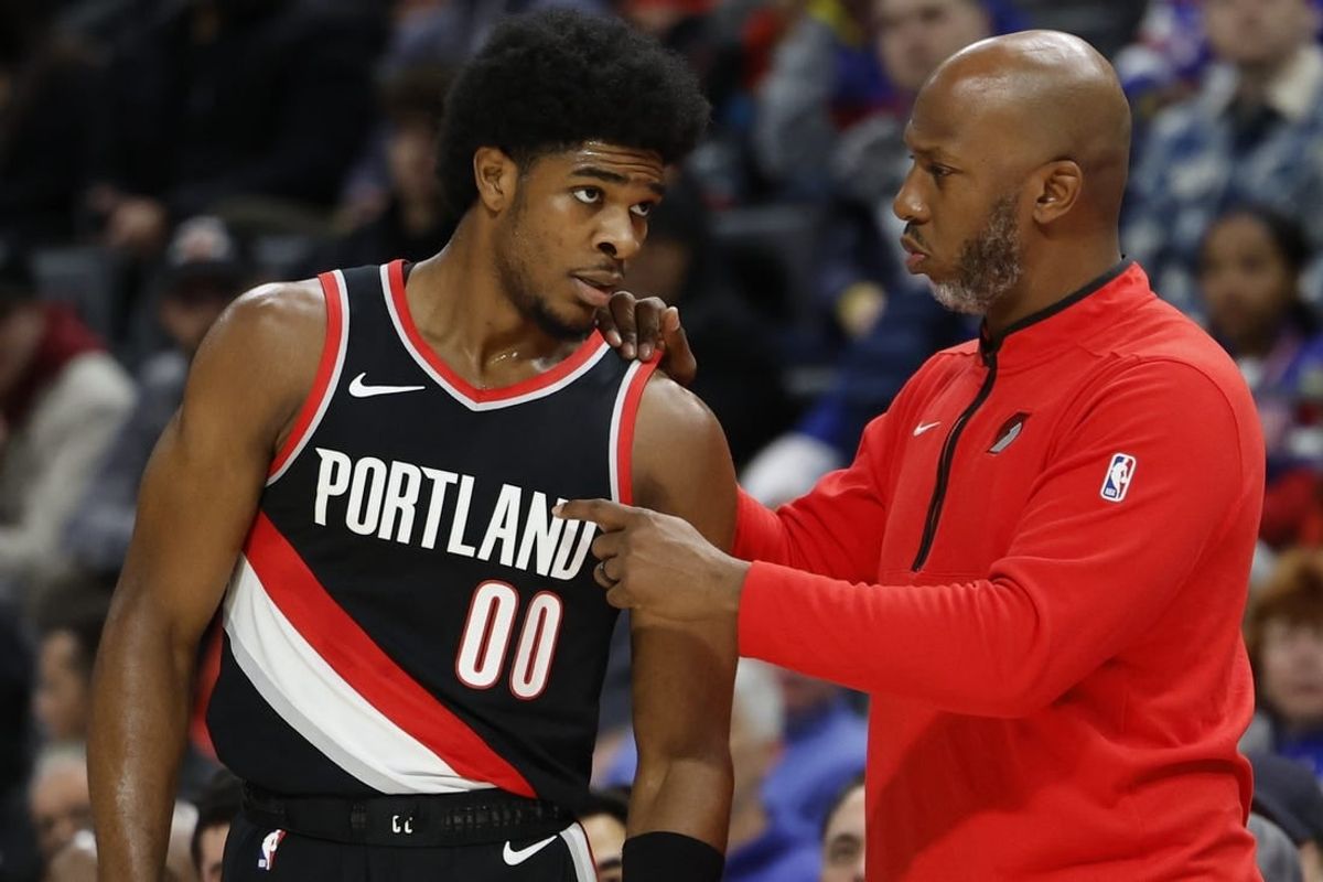Nov 1, 2023; Detroit, Michigan, USA;  Portland Trail Blazers head coach Chauncey Billups talks to guard Scoot Henderson (00) in the first half against the Detroit Pistons at Little Caesars Arena.