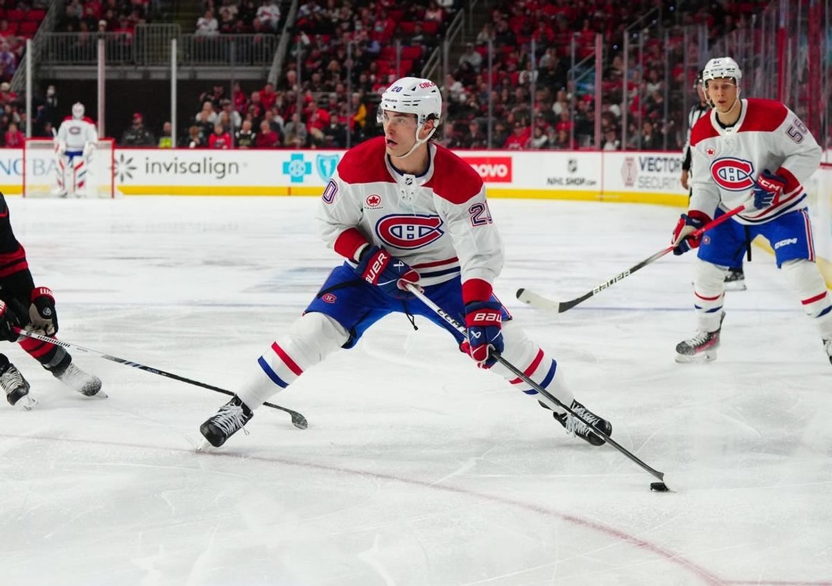 Mar 7, 2024; Raleigh, North Carolina, USA; Montreal Canadiens left wing Juraj Slafkovsky (20) skates with the puck against the Carolina Hurricanes during the second period at PNC Arena.