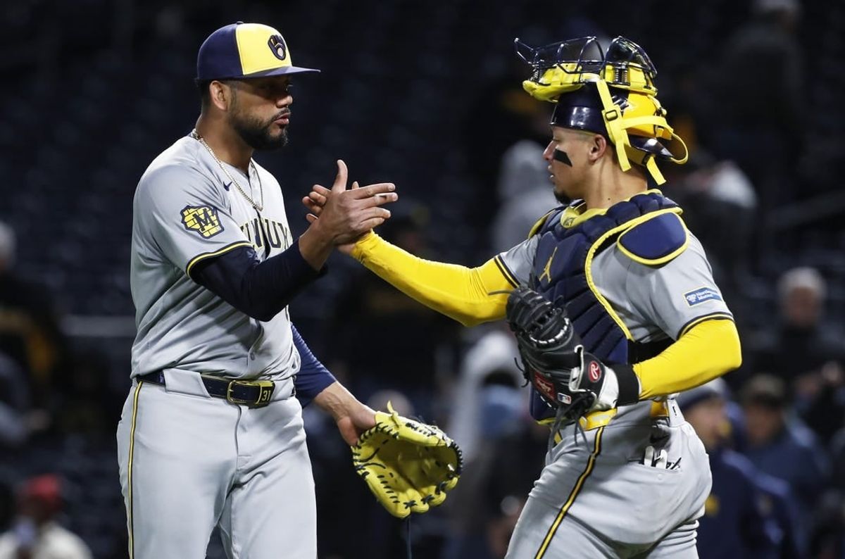 Apr 24, 2024; Pittsburgh, Pennsylvania, USA;  Milwaukee Brewers relief pitcher Joel Payamps (31) and catcher William Contreras (24) shake hands after defeating the Pittsburgh Pirates at PNC Park. The Brewers won 3-2.