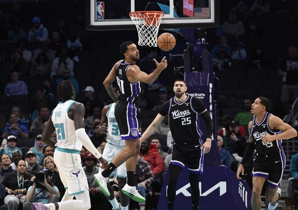Jan 10, 2024; Charlotte, North Carolina, USA; Sacramento Kings forward Trey Lyles (41) gets a rebound during the first half against the Charlotte Hornets at the Spectrum Center.
