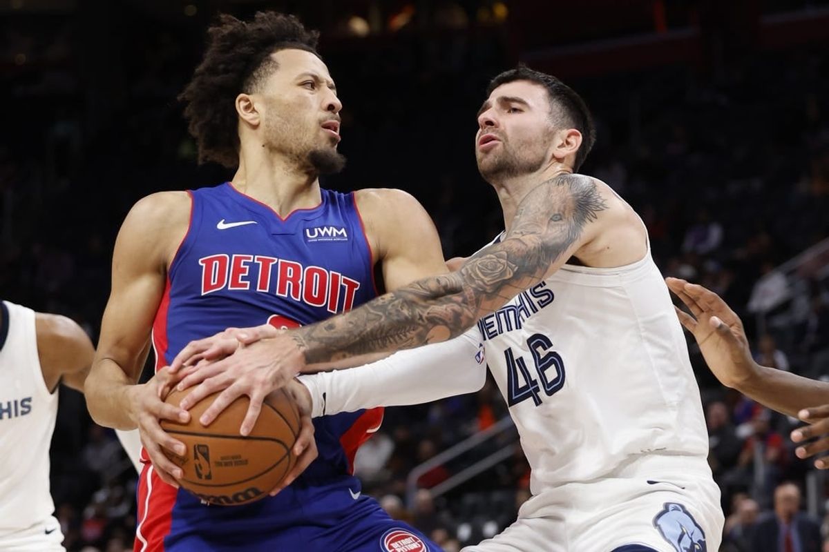 Dec 6, 2023; Detroit, Michigan, USA;  Memphis Grizzlies guard John Konchar (46) strips the ball from Detroit Pistons guard Cade Cunningham (2) in the first half at Little Caesars Arena.