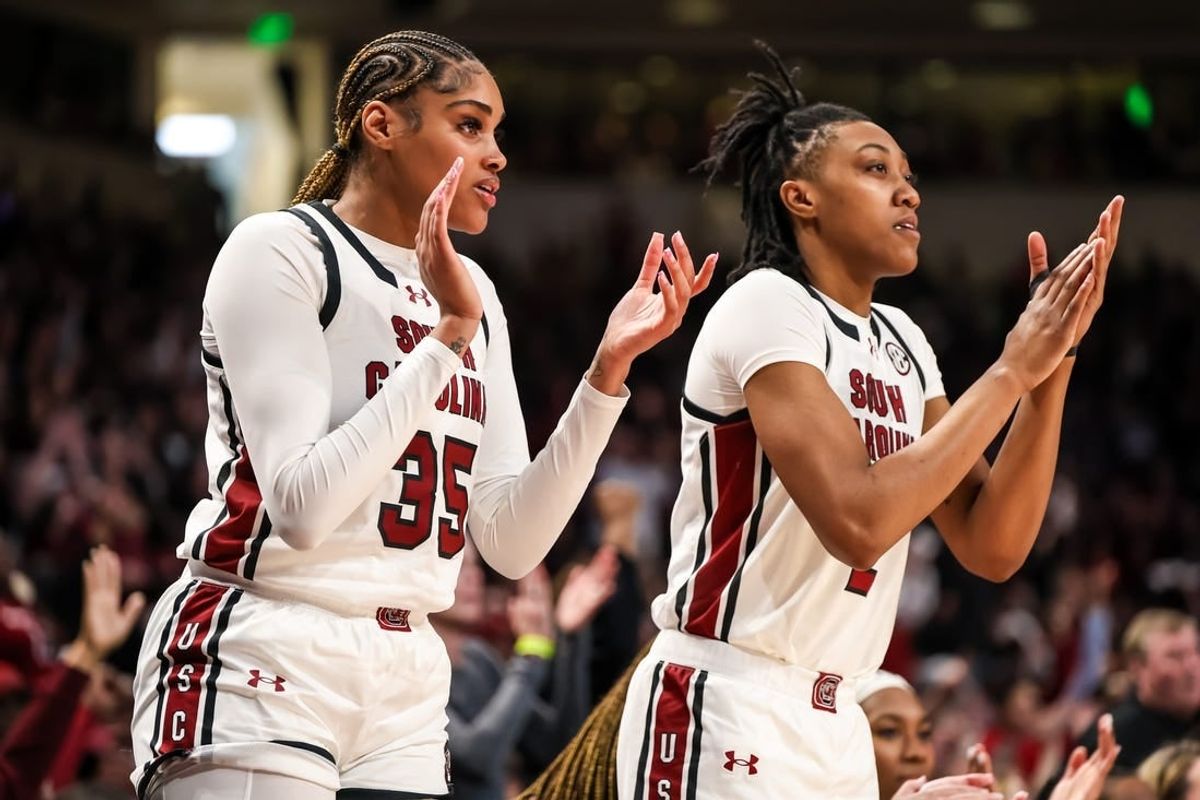 Feb 18, 2024; Columbia, South Carolina, USA; South Carolina Gamecocks center Sakima Walker (35) and forward Ashlyn Watkins (2) cheer from the bench against the Georgia Lady Bulldogs in the second half at Colonial Life Arena.