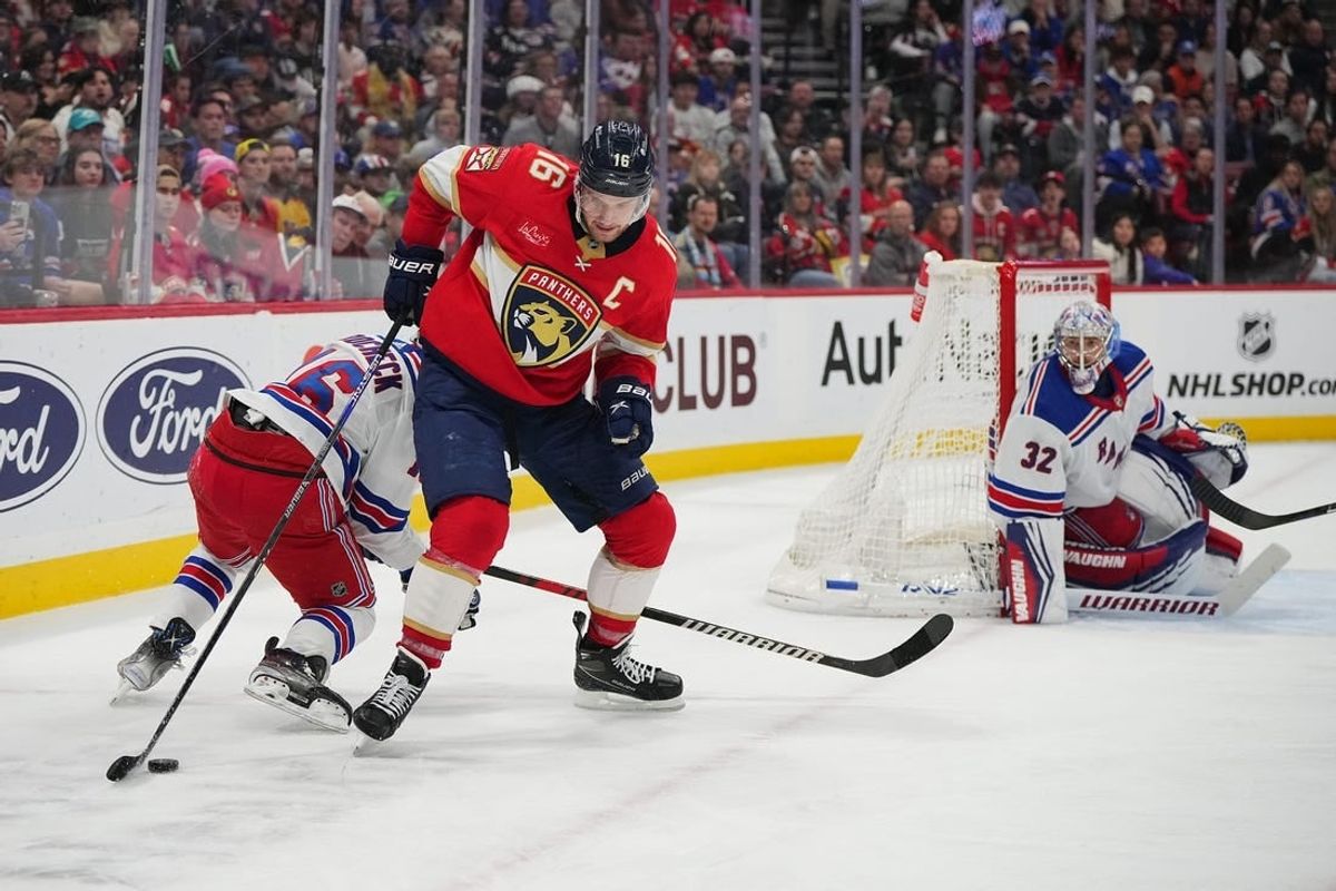 Dec 29, 2023; Sunrise, Florida, USA; Florida Panthers center Aleksander Barkov (16) controls the puck against the New York Rangers during the second period at Amerant Bank Arena.