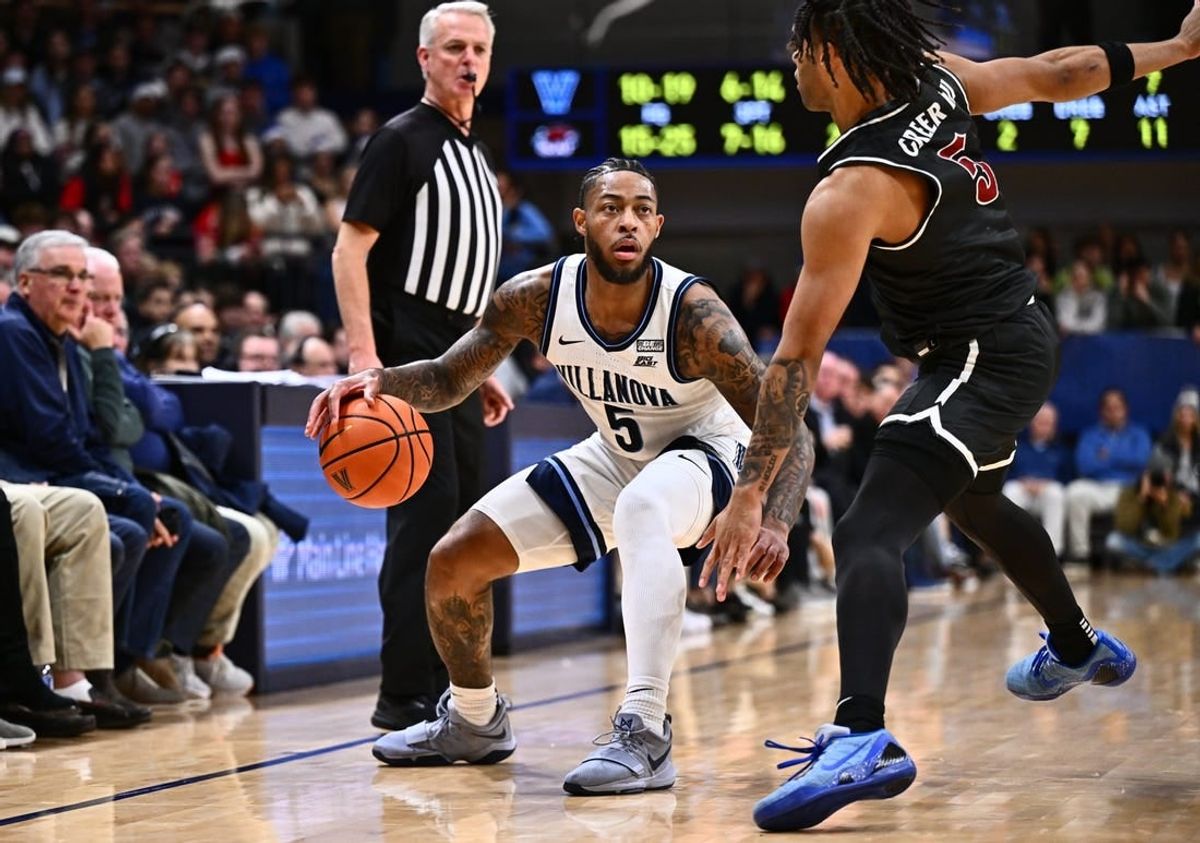 Nov 29, 2023; Villanova, Pennsylvania, USA; Villanova Wildcats guard Justin Moore (5) dribbles the ball against Saint Joseph's Hawks guard Lynn Greer III (5) in the first half at William B. Finneran Pavilion.