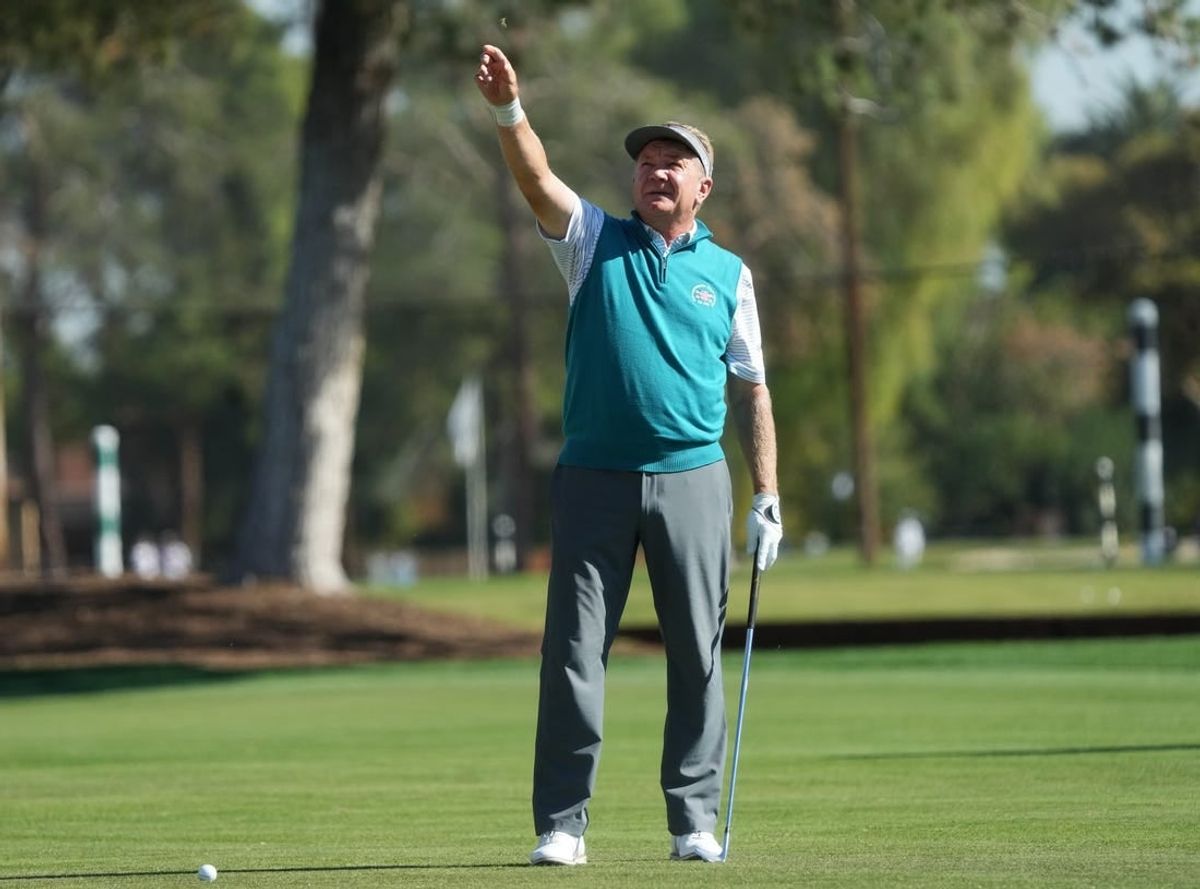 Nov 10, 2023; Phoenix, AZ, USA; Paul Broadhurst tests the wind speed before a hit from the fairway on the ninth hole during round 2 of the Charles Schwab Cup championship at Phoenix Country Club.
