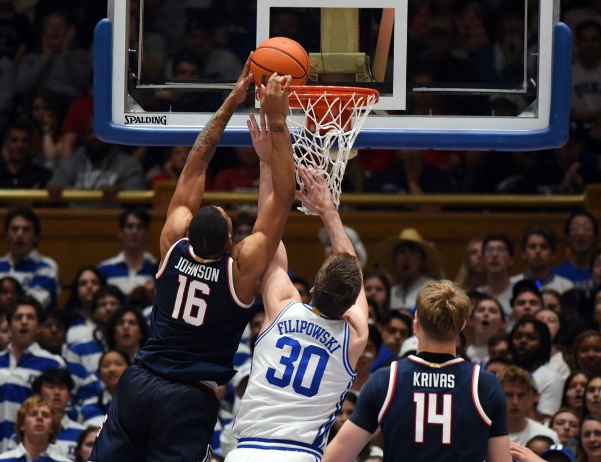 Nov 10, 2023; Durham, North Carolina, USA;  Arizona Wildcats forward Keshad Johnson (16) tips the ball into the basket in front of Duke Blue Devils center Kyle Filipowski(30)during the second half at Cameron Indoor Stadium.
