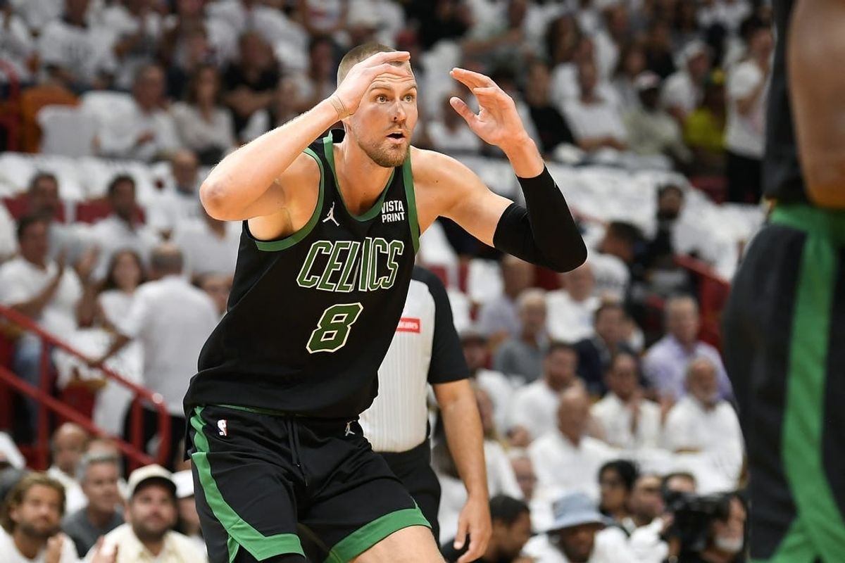 Apr 29, 2024; Miami, Florida, USA; Boston Celtics center Kristaps Porzingis (8) reacts to a foul call while playing the Miami Heat during the first quarter of game four of the first round for the 2024 NBA playoffs at Kaseya Center.