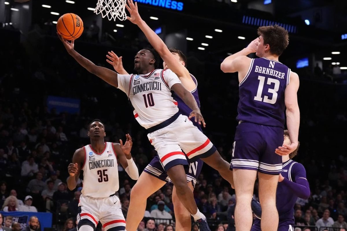 Mar 24, 2024; Brooklyn, NY, USA; Connecticut Huskies guard Hassan Diarra (10) shoots the ball against the Northwestern Wildcats in the second round of the 2024 NCAA Tournament at the Barclays Center.