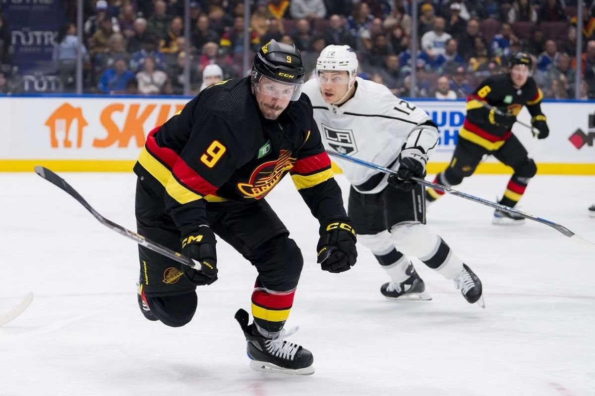 Feb 29, 2024; Vancouver, British Columbia, CAN; Vancouver Canucks forward J.T. Miller (9) skates after the loose puck against the Los Angeles Kings in the third period at Rogers Arena. Kings won 5-1.