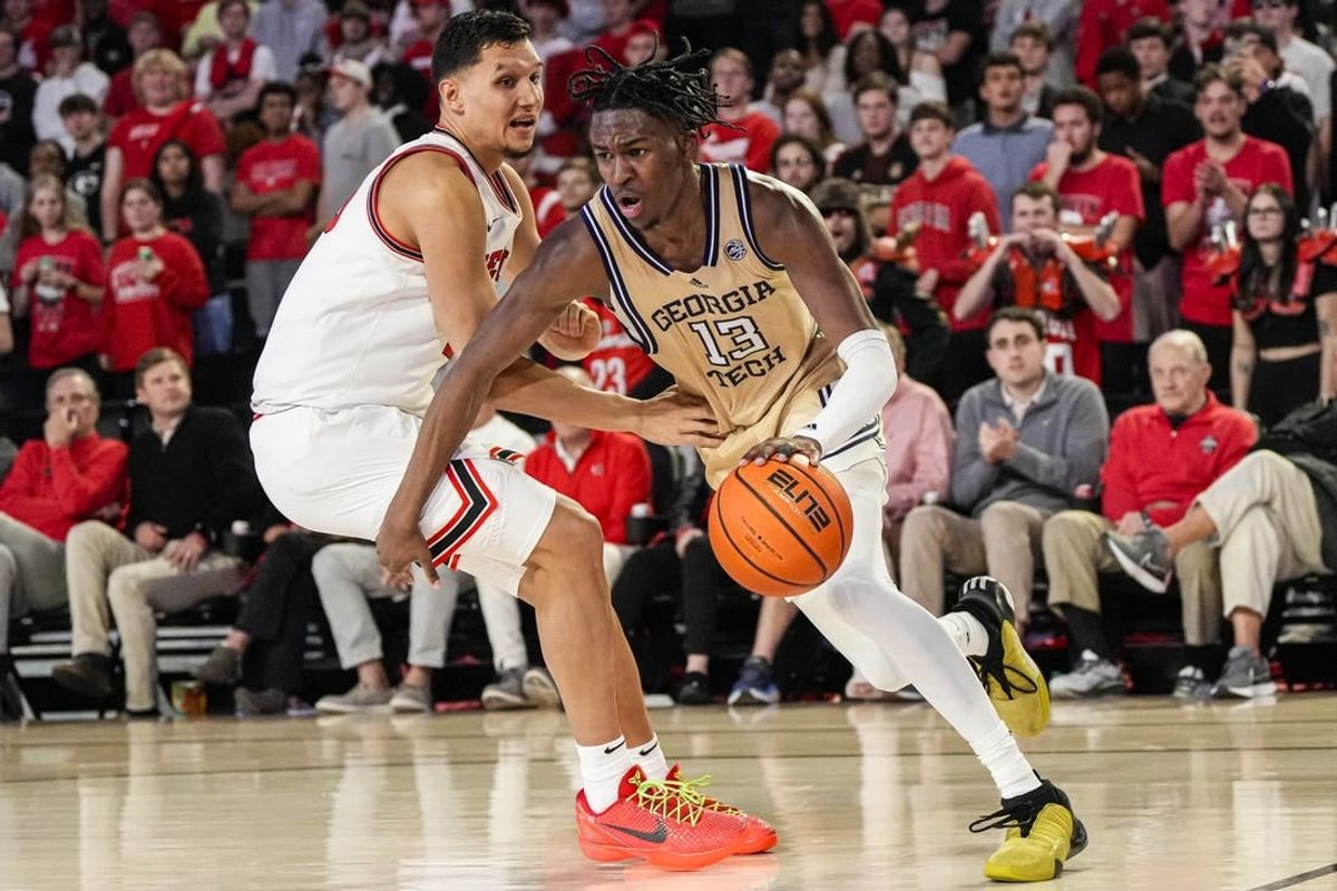 Dec 5, 2023; Athens, Georgia, USA; Georgia Tech Yellow Jackets guard Miles Kelly (13) dribbles against Georgia Bulldogs guard RJ Melendez (15) during the second half at Stegeman Coliseum.