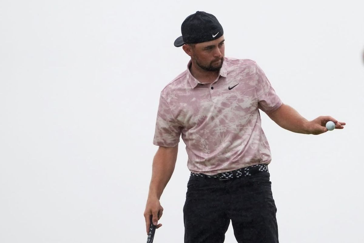 Jul 23, 2023; Hoylake, England, GBR; Alex Fitzpatrick acknowledges the crowd after a putt on the 13th green during the final round of The Open Championship golf tournament.