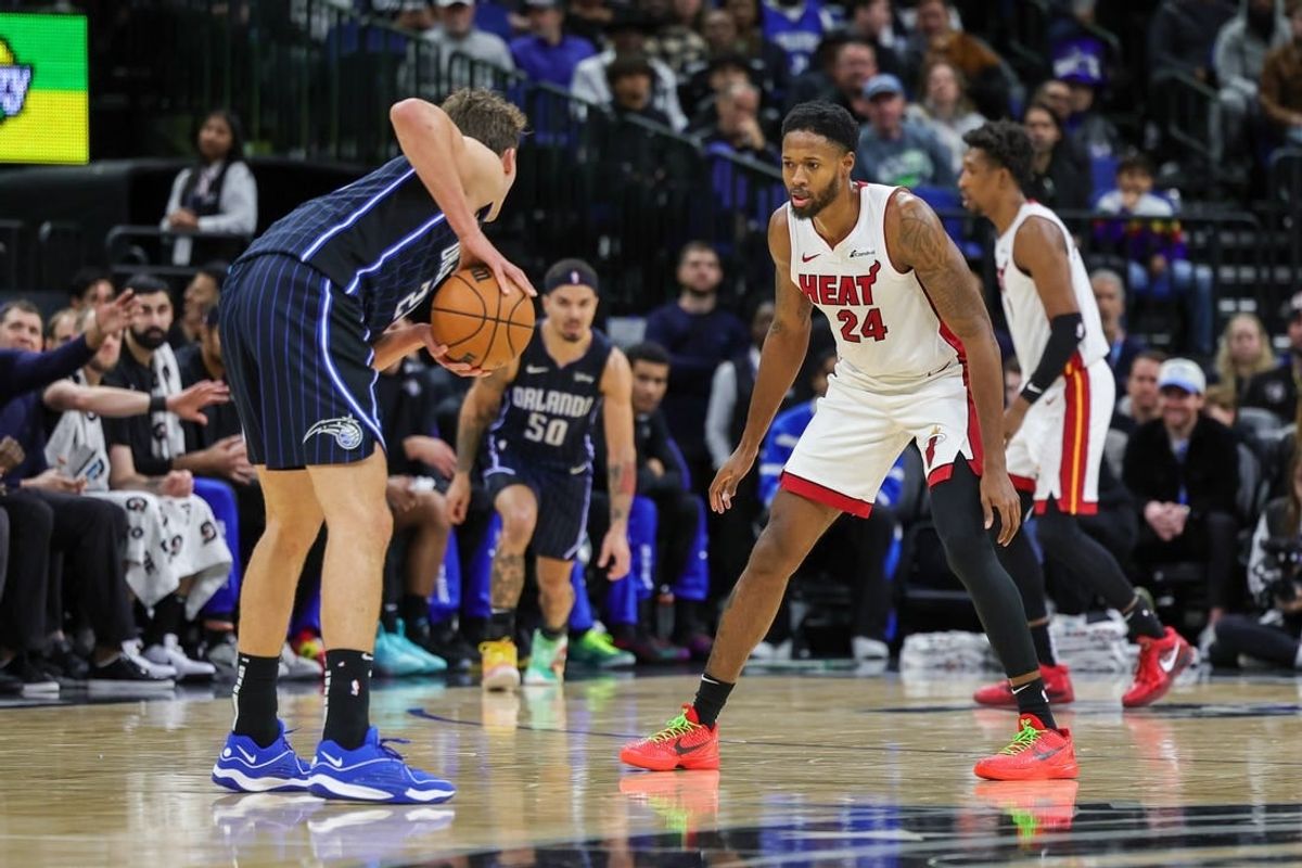 Jan 21, 2024; Orlando, Florida, USA; Miami Heat forward Haywood Highsmith (24) defends Orlando Magic forward Franz Wagner (22) during the second quarter at Amway Center.