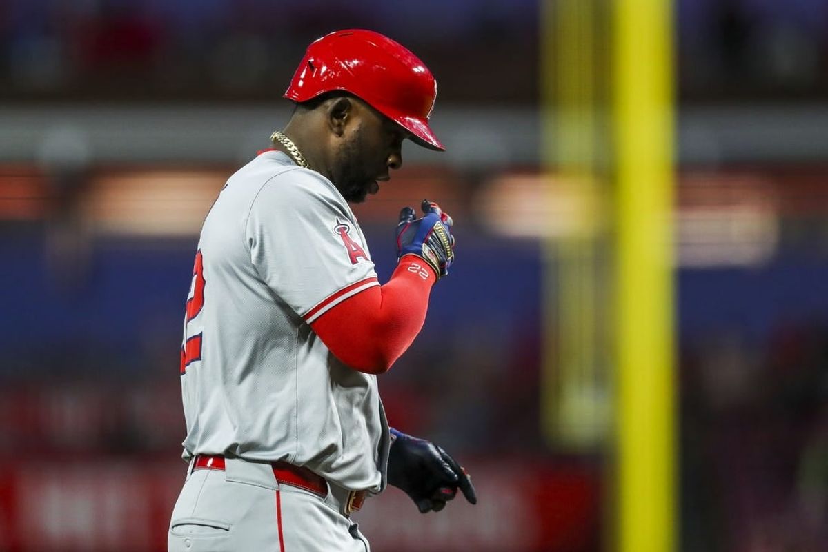 Apr 20, 2024; Cincinnati, Ohio, USA; Los Angeles Angels designated hitter Miguel Sano (22) reacts after hitting a two-run home run in the sixth inning against the Cincinnati Reds at Great American Ball Park.