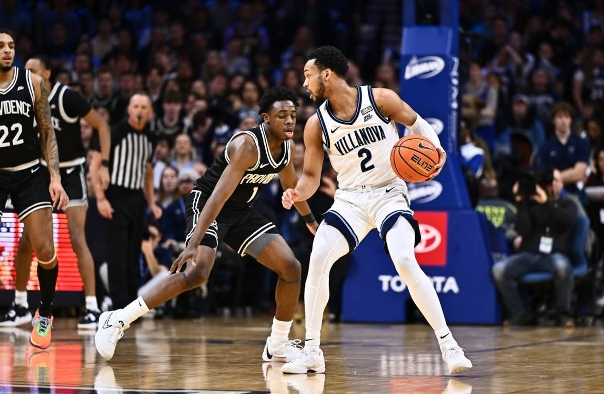 Feb 4, 2024; Philadelphia, Pennsylvania, USA; Villanova Wildcats guard Mark Armstrong (2) controls the ball against Providence Friars guard Jayden Pierre (1) in the first half at Wells Fargo Center.