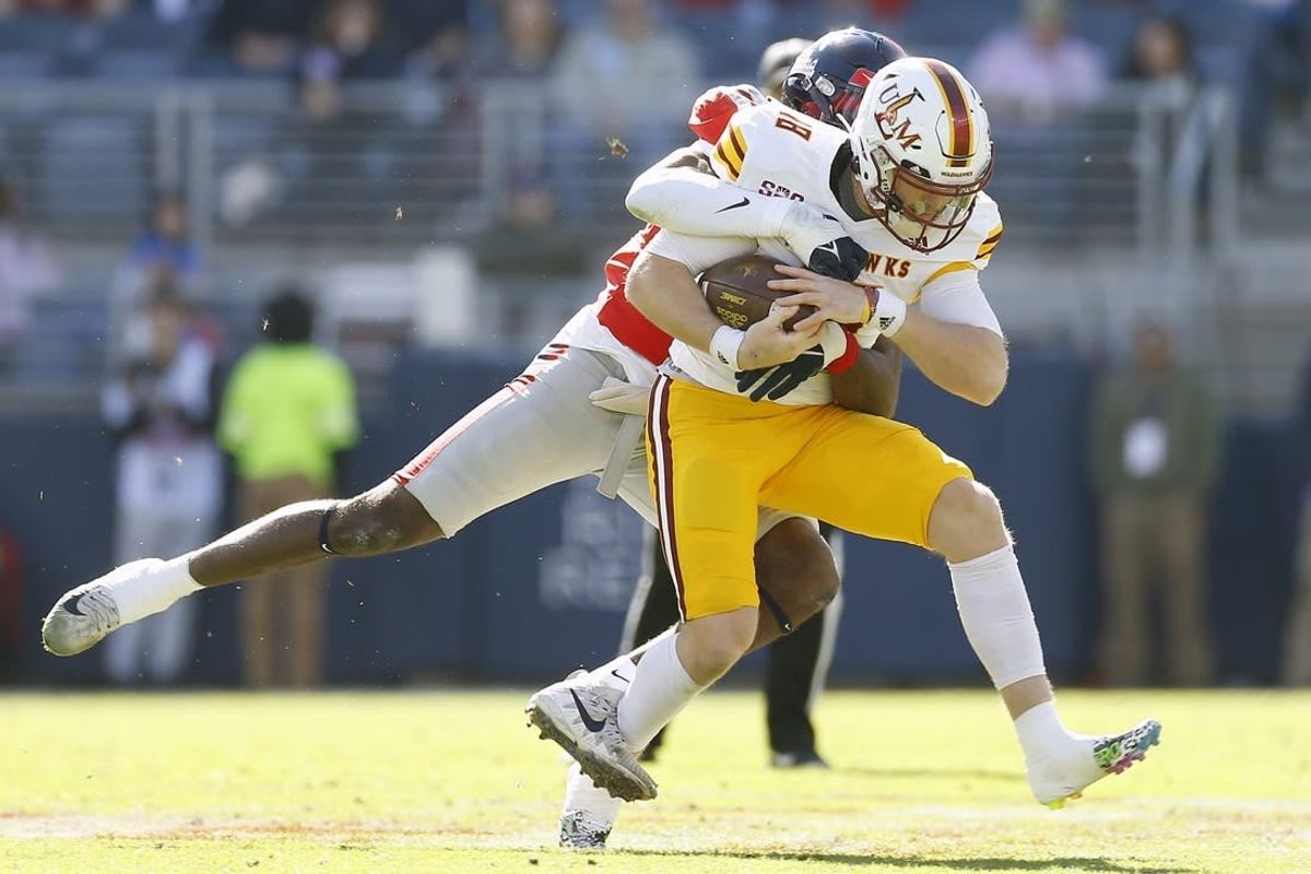 Nov 18, 2023; Oxford, Mississippi, USA; Louisiana Monroe Warhawks quarterback Jiya Wright (18) runs the ball as Mississippi Rebels defensive back Ladarius Tennison (13) makes the tackle during the first half at Vaught-Hemingway Stadium.