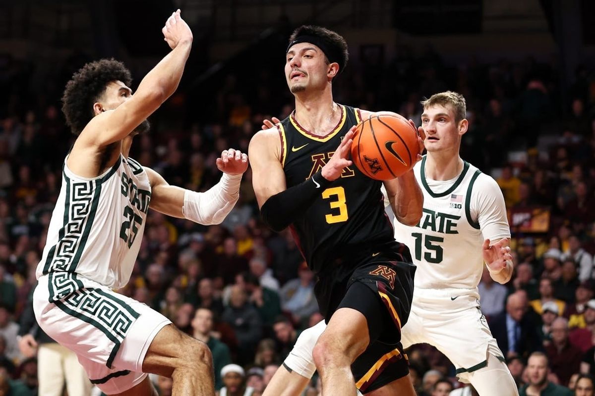Feb 6, 2024; Minneapolis, Minnesota, USA; Minnesota Golden Gophers forward Dawson Garcia (3) works around Michigan State Spartans forward Malik Hall (25) and center Carson Cooper (15) during the first half at Williams Arena.