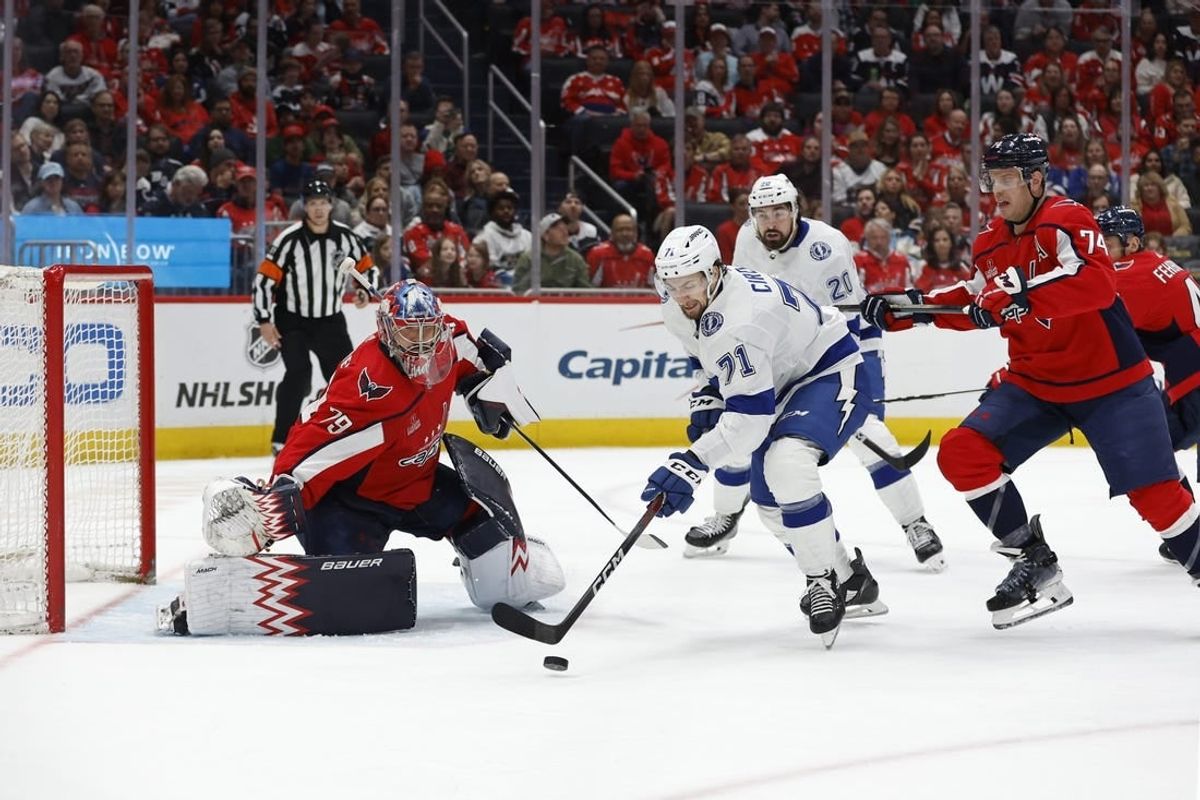 Apr 13, 2024; Washington, District of Columbia, USA; Washington Capitals goaltender Charlie Lindgren (79) prepares to make a save on Tampa Bay Lightning center Anthony Cirelli (71) as Capitals defenseman John Carlson (74) defends in the second period at Capital One Arena.