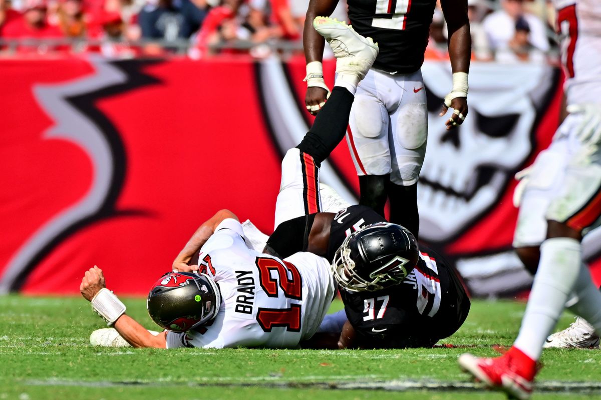Tom Brady gets sacked in a game against the Falcons