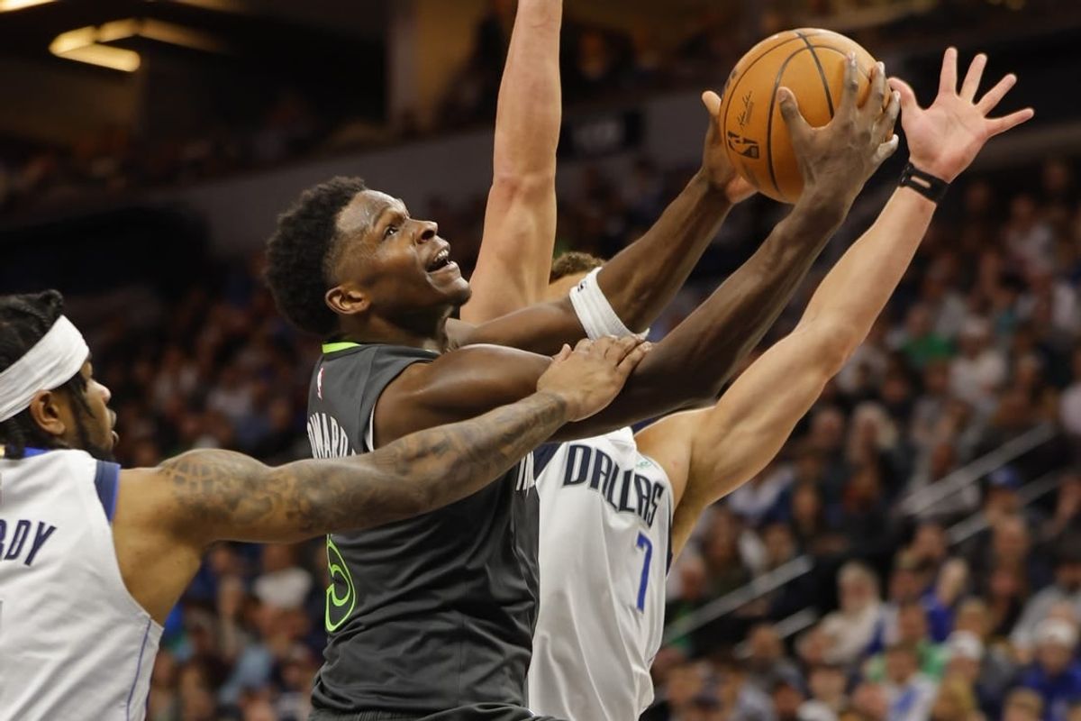 Dec 28, 2023; Minneapolis, Minnesota, USA; Dallas Mavericks guard Jaden Hardy (1) fouls Minnesota Timberwolves guard Anthony Edwards (5) as he goes to the basket in the third quarter at Target Center.