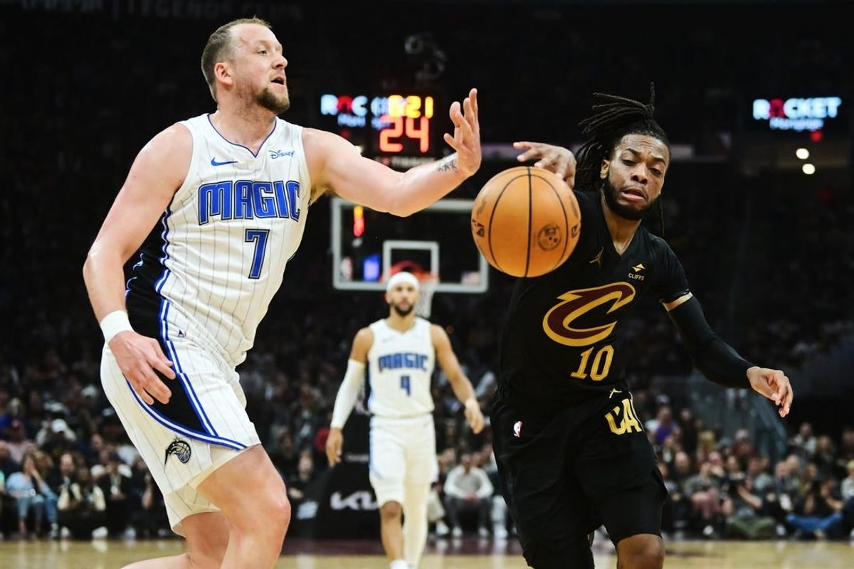 Apr 30, 2024; Cleveland, Ohio, USA; Orlando Magic guard Joe Ingles (7) goes for a loose ball against Cleveland Cavaliers guard Darius Garland (10) during the first half in game five of the first round for the 2024 NBA playoffs at Rocket Mortgage FieldHouse.