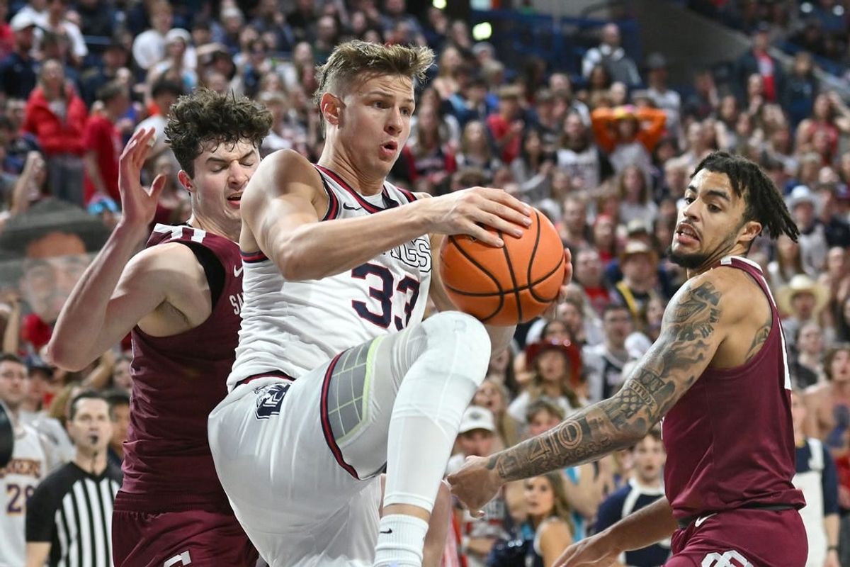 Feb 24, 2024; Spokane, Washington, USA; Gonzaga Bulldogs forward Ben Gregg (33) rebounds the ball against Santa Clara Broncos forward Johnny O'Neil (14) in the second half at McCarthey Athletic Center. Gonzaga Bulldogs won 94-81.