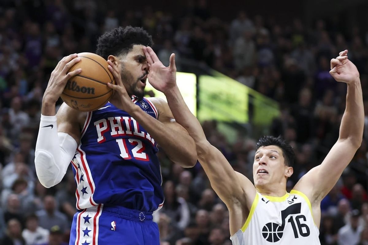 Feb 1, 2024; Salt Lake City, Utah, USA; Philadelphia 76ers forward Tobias Harris (12) is fouled by Utah Jazz forward Simone Fontecchio (16) during the fourth quarter at Delta Center.