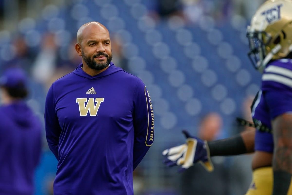 Oct 16, 2021; Seattle, Washington, USA; Washington Huskies head coach Jimmy Lake watches pregame warmups against the UCLA Bruins at Alaska Airlines Field at Husky Stadium.