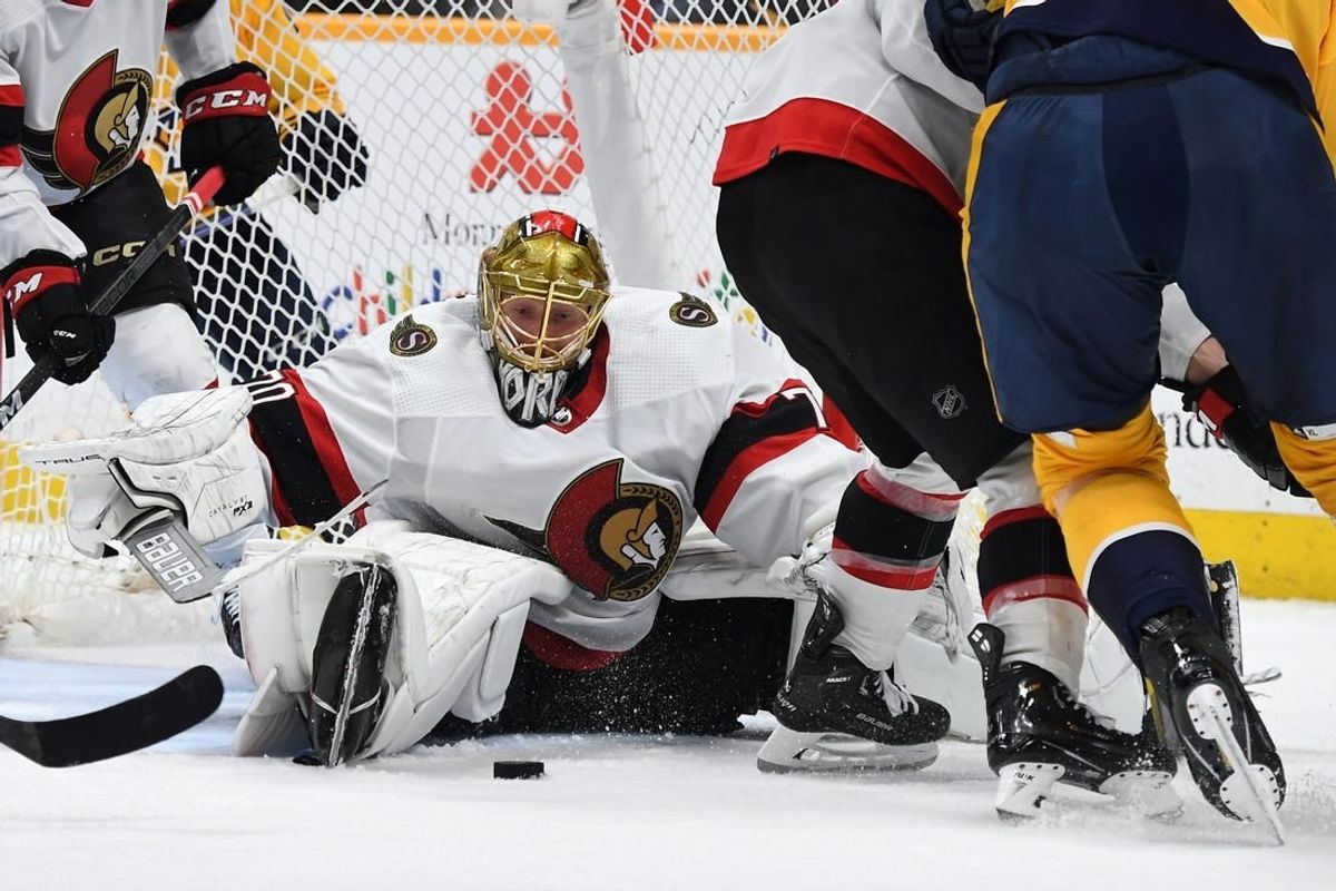 Feb 27, 2024; Nashville, Tennessee, USA; Ottawa Senators goaltender Joonas Korpisalo (70) makes a save during the third period against the Nashville Predators at Bridgestone Arena.