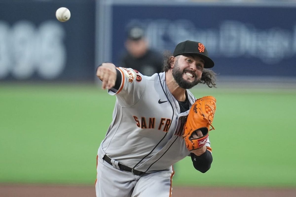 Aug 31, 2023; San Diego, California, USA;  San Francisco Giants starting pitcher Jakob Junis (34) throws a pitch against the San Diego Padres during the first inning at Petco Park.