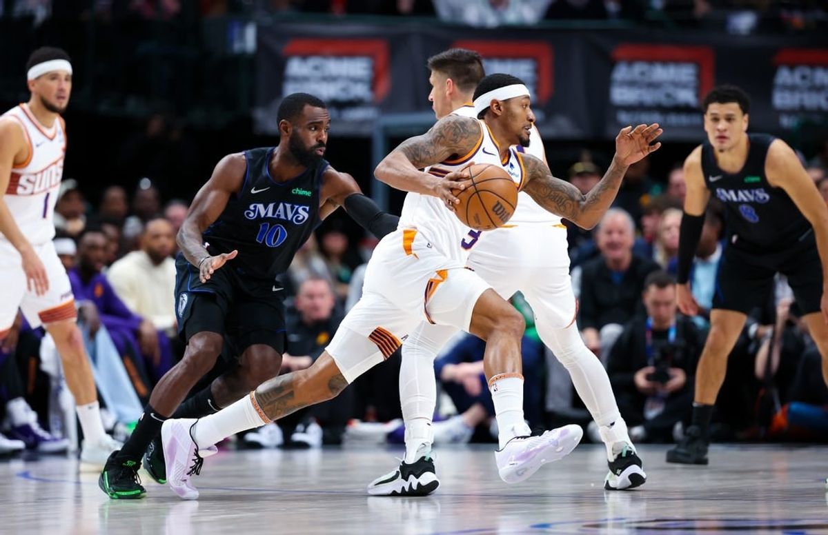 Jan 24, 2024; Dallas, Texas, USA;  Phoenix Suns guard Bradley Beal (3) controls the ball as Dallas Mavericks forward Tim Hardaway Jr. (10) defends during the first half at American Airlines Center.