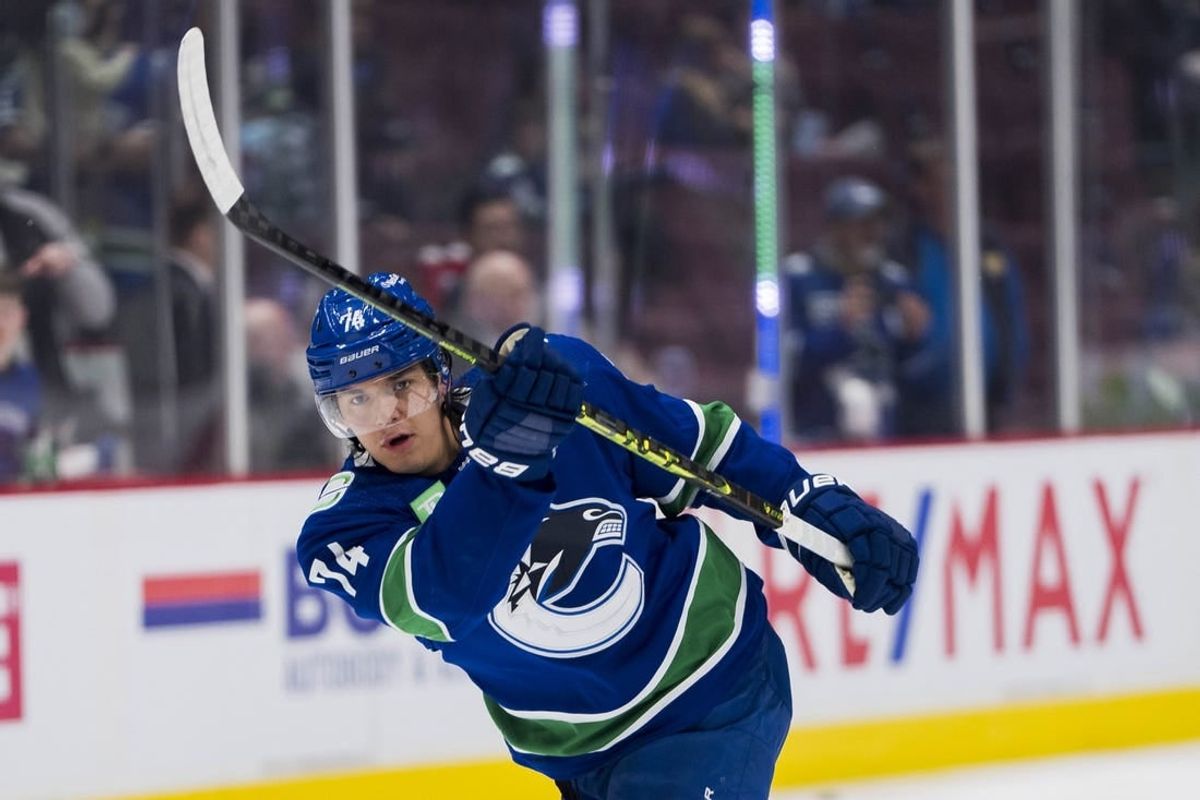 Apr 2, 2023; Vancouver, British Columbia, CAN; Vancouver Canucks defenseman Ethan Bear (74) shoots during warm up prior to a game against the Los Angeles Kings at Rogers Arena.