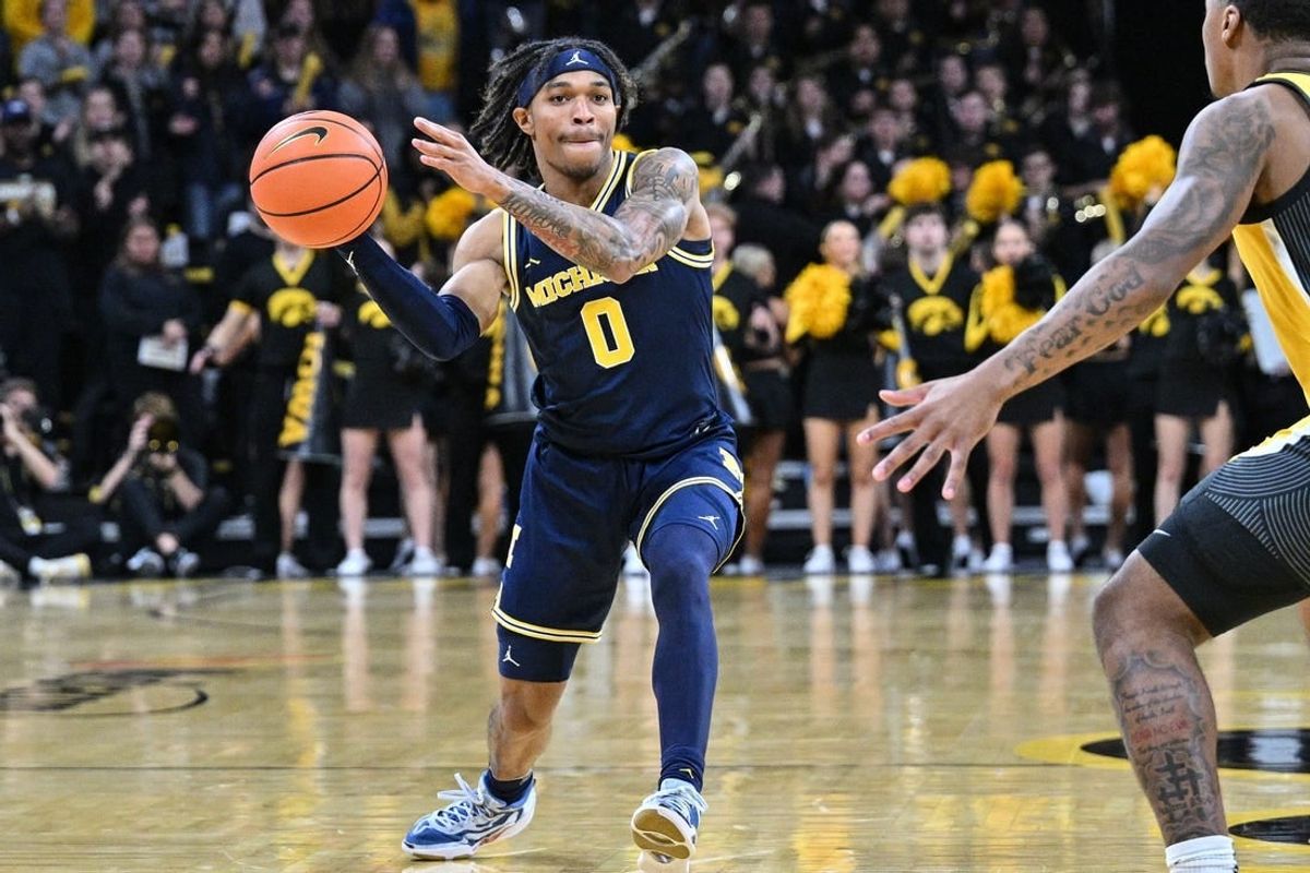 Dec 10, 2023; Iowa City, Iowa, USA; Michigan Wolverines guard Dug McDaniel (0) in action during the game against the Iowa Hawkeyes at Carver-Hawkeye Arena.