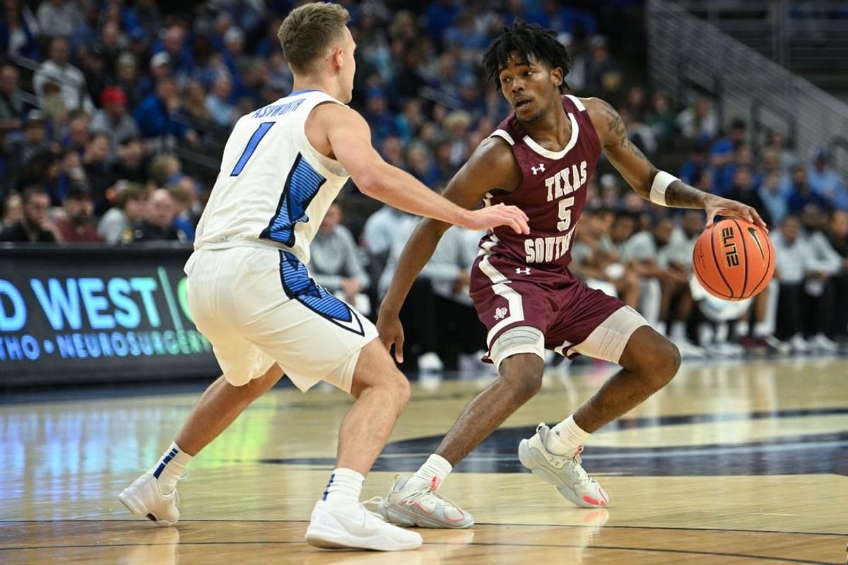 Nov 18, 2023; Omaha, Nebraska, USA; Texas Southern Tigers guard Jaylen Wysinger (5) dribbles against Creighton Bluejays guard Steven Ashworth (1) in the first half at CHI Health Center Omaha.