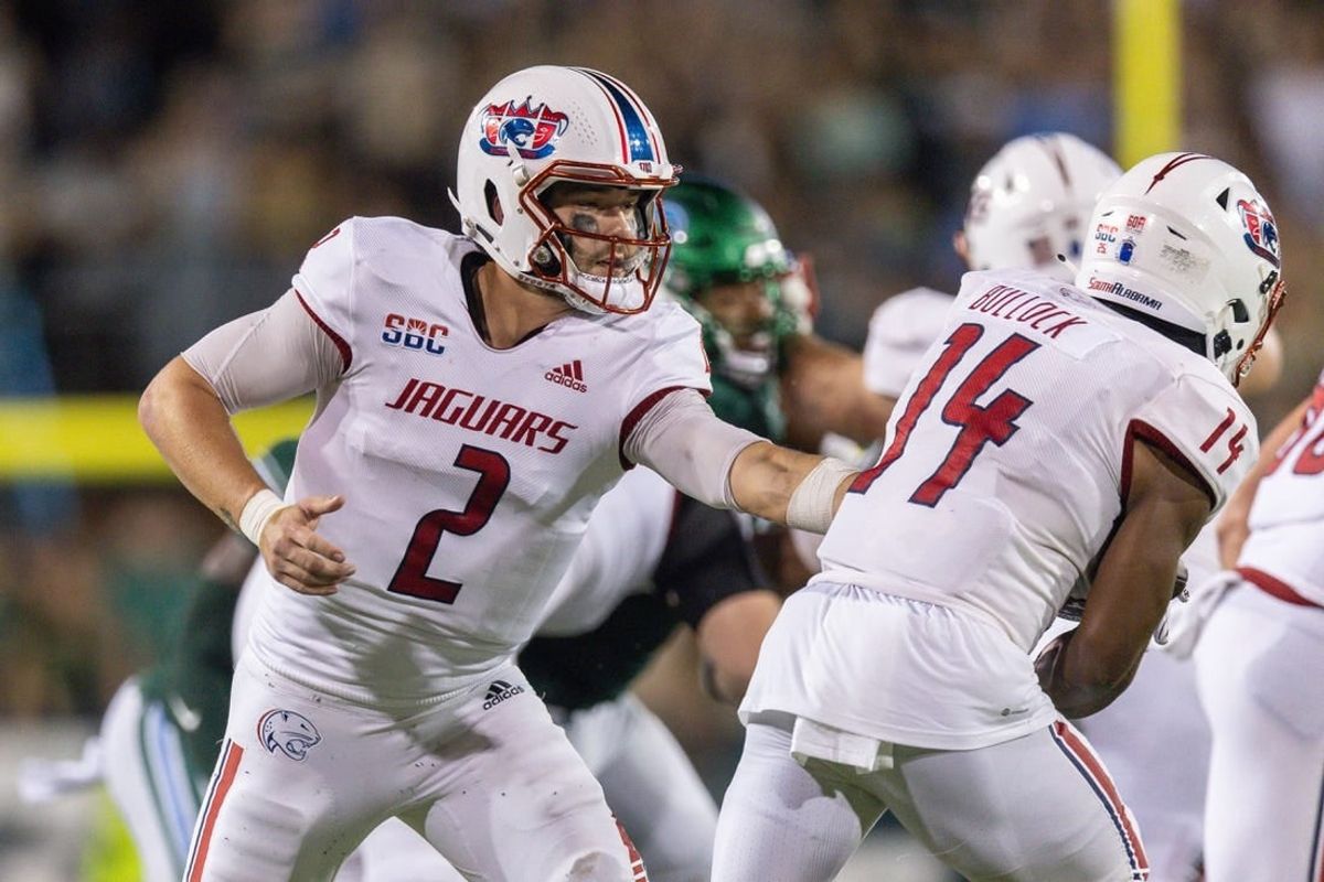 Sep 2, 2023; New Orleans, Louisiana, USA;  South Alabama Jaguars quarterback Carter Bradley (2) hands the ball off to South Alabama Jaguars running back Kentrel Bullock (14) against the Tulane Green Wave during the first half at Yulman Stadium.