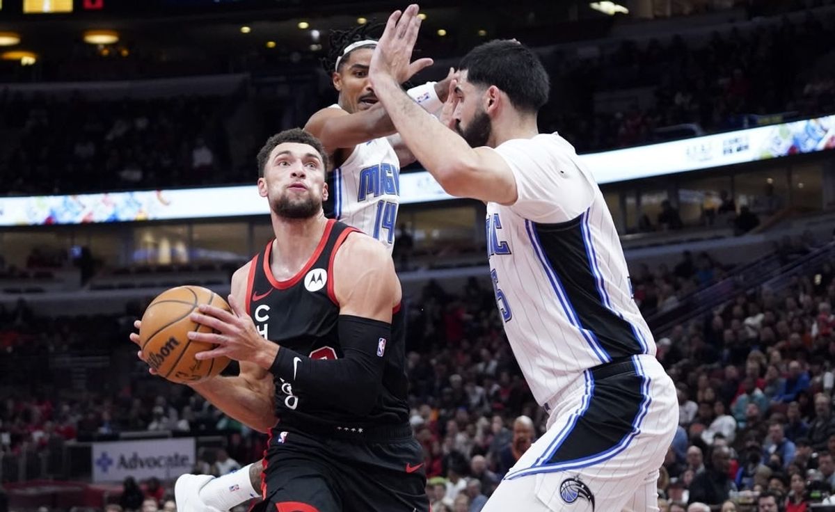 Nov 17, 2023; Chicago, Illinois, USA; Orlando Magic guard Gary Harris (14) defends Chicago Bulls guard Zach LaVine (8) during the first half at United Center.