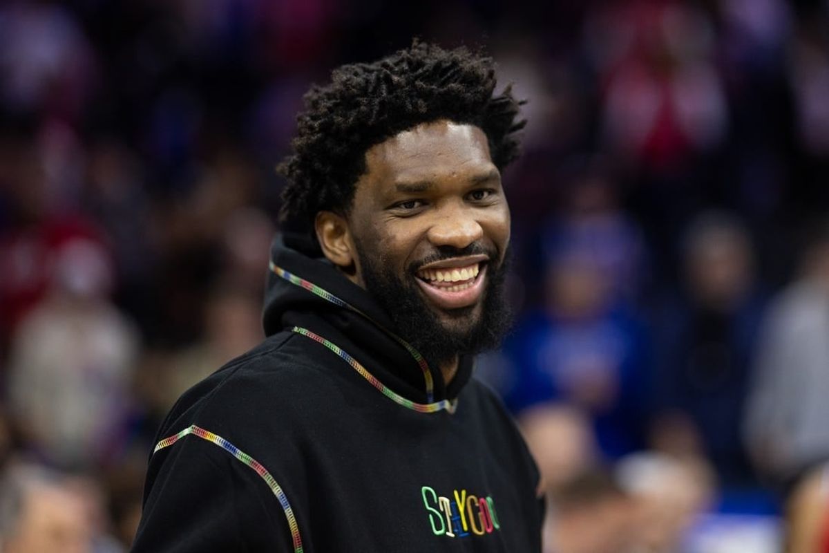 Mar 1, 2024; Philadelphia, Pennsylvania, USA; Injured Philadelphia 76ers center Joel Embiid smiles after a victory against the Charlotte Hornets at Wells Fargo Center.