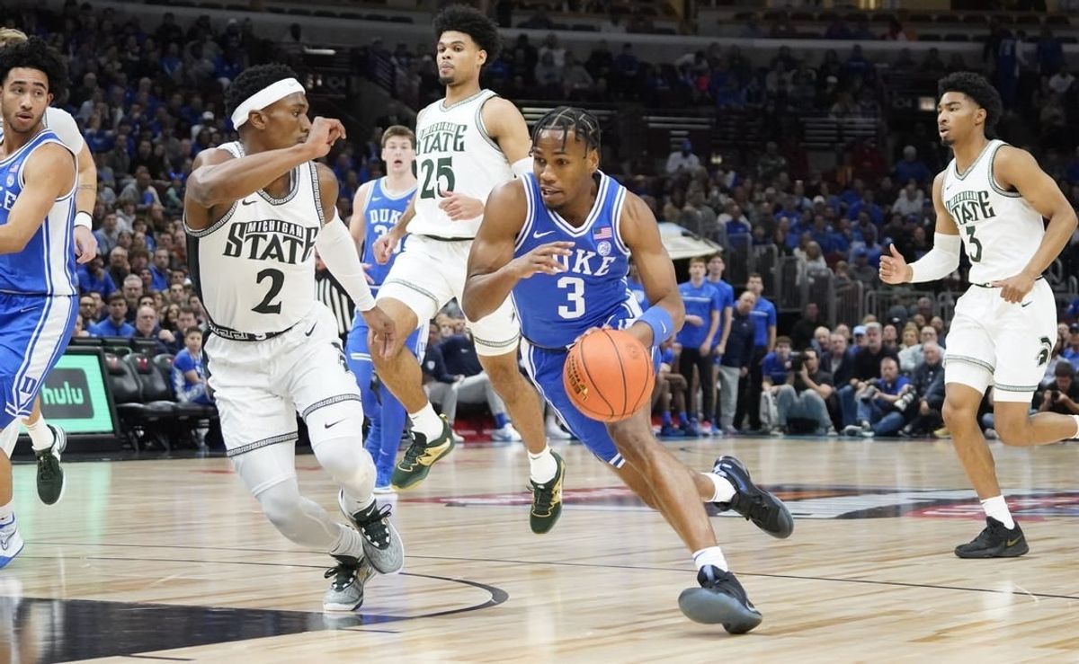 Nov 14, 2023; Chicago, Illinois, USA; Michigan State Spartans guard Tyson Walker (2) defends Duke Blue Devils guard Jeremy Roach (3) during the first half at United Center.