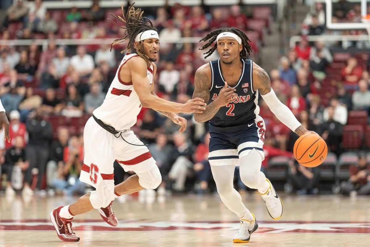 Dec 31, 2023; Stanford, California, USA; Arizona Wildcats guard Caleb Love (2) drives the ball during the second half against Stanford Cardinal guard Kanaan Carlyle (3) at Maples Pavilion.