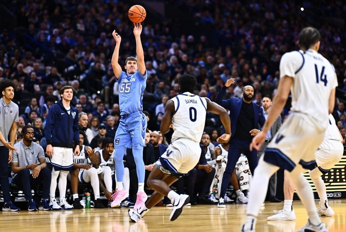 Mar 9, 2024; Philadelphia, Pennsylvania, USA; Creighton Bluejays guard Baylor Scheierman (55) shoots over Villanova Wildcats guard TJ Bamba (0) in the first half at Wells Fargo Center.