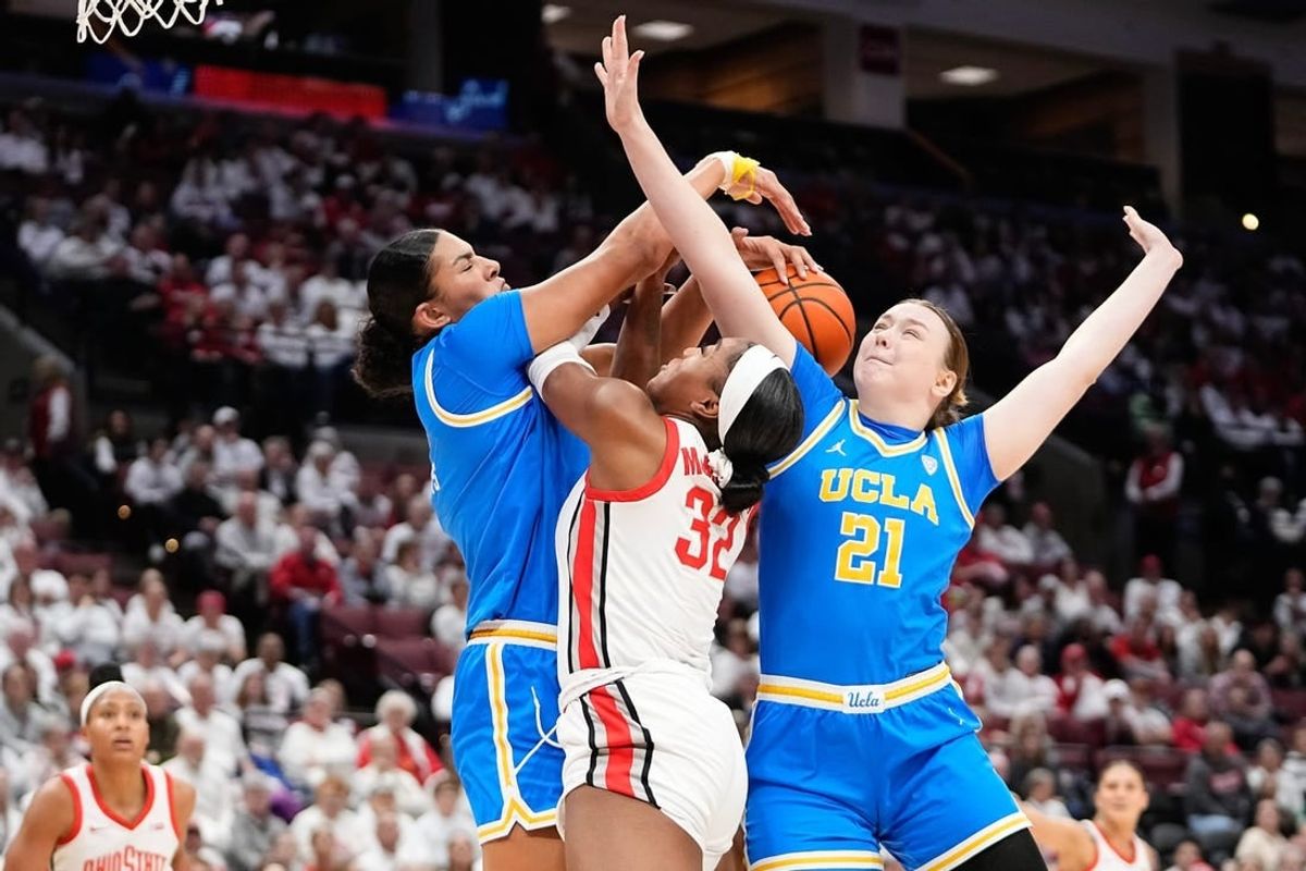 Dec 18, 2023; Columbus, OH, USA; UCLA Bruins center Lauren Betts (51) and forward Lina Sontag (21) block the shot of Ohio State Buckeyes forward Cotie McMahon (32) during the first half of the NCAA women   s basketball game at Value City Arena.